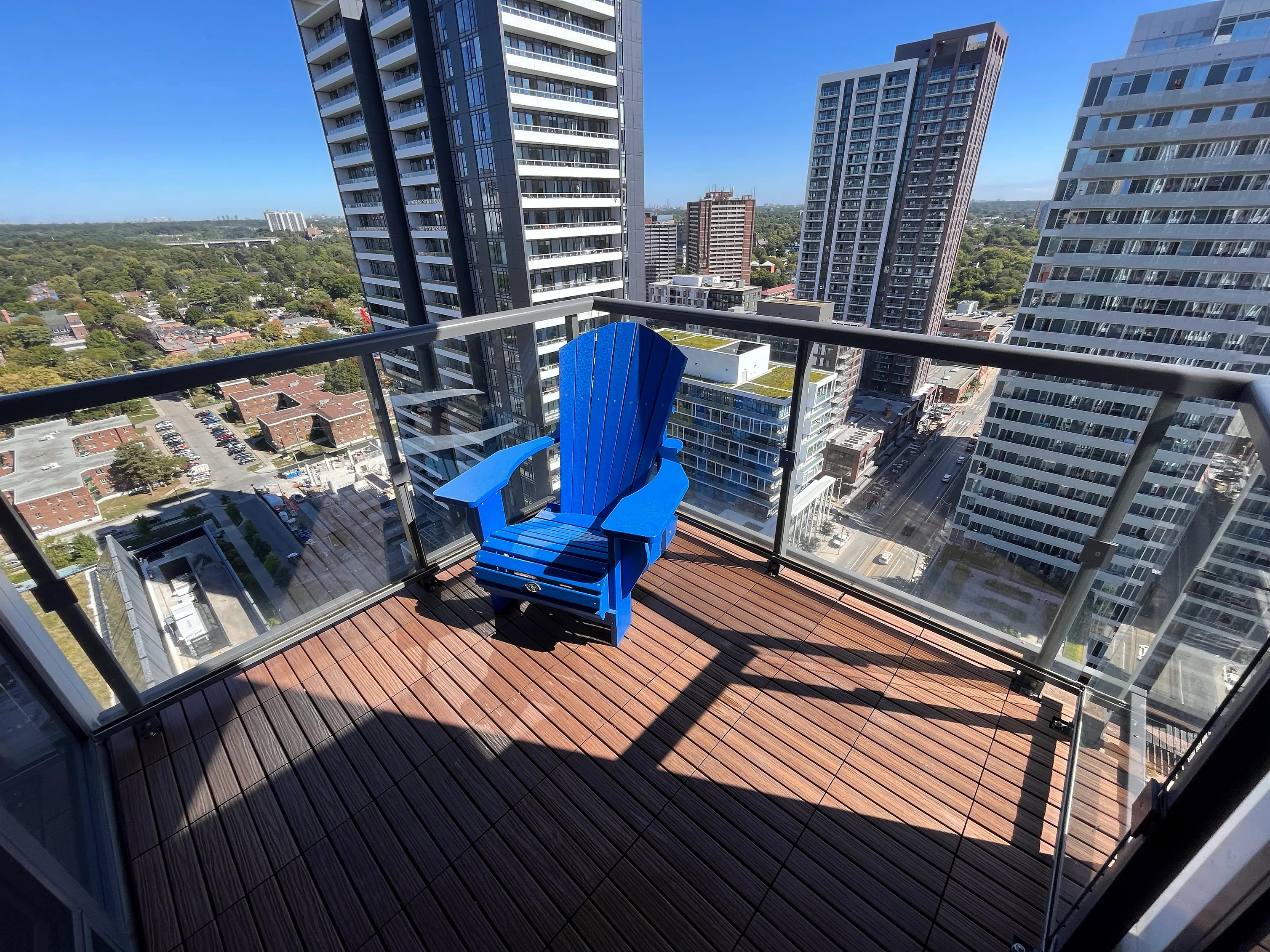 Clean condo balcony with blue chair